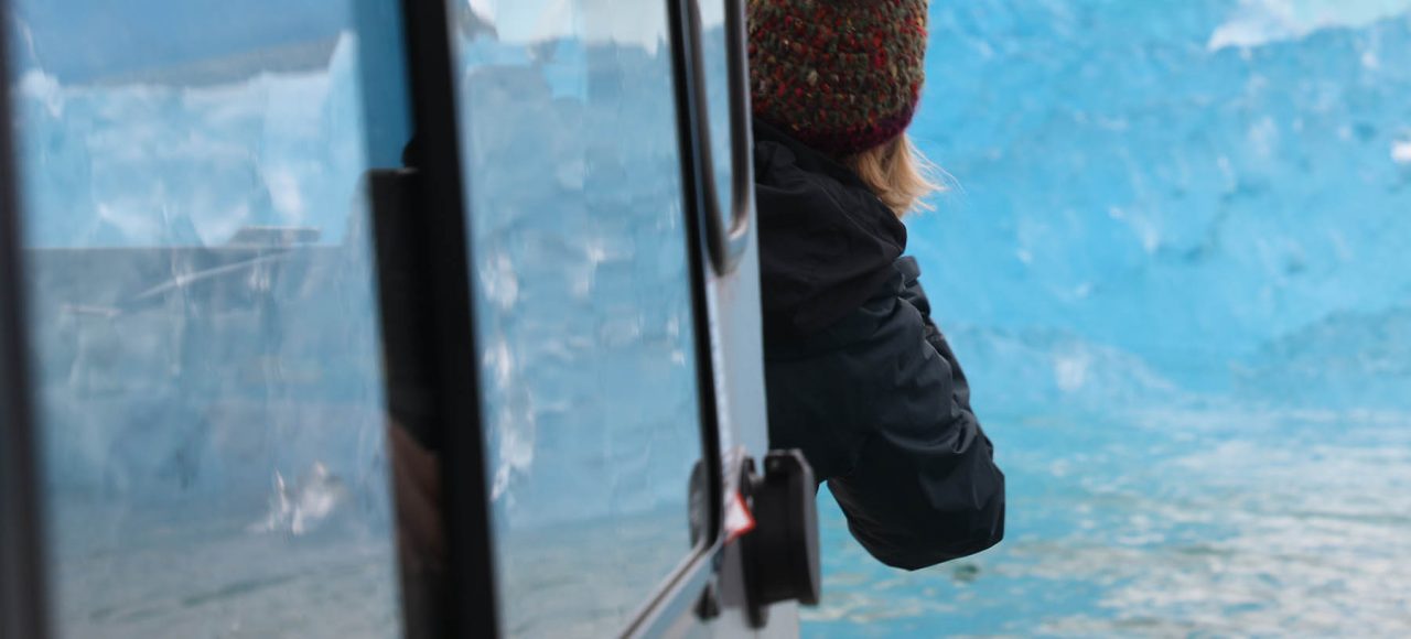 Photographing blue ice in LeConte Bay fjord during glacier photo tour by FauneVoyage Tours in Petersburg, Alaska