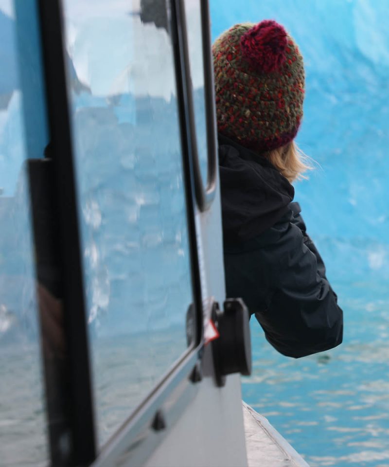 Photographing blue ice in LeConte Bay fjord during glacier photo tour by FauneVoyage Tours in Petersburg, Alaska